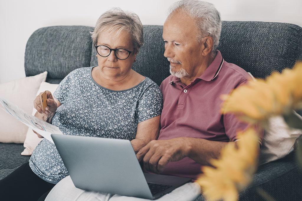 Elderly Man and Woman Checking Documents About What Is an Advanced Care Directive