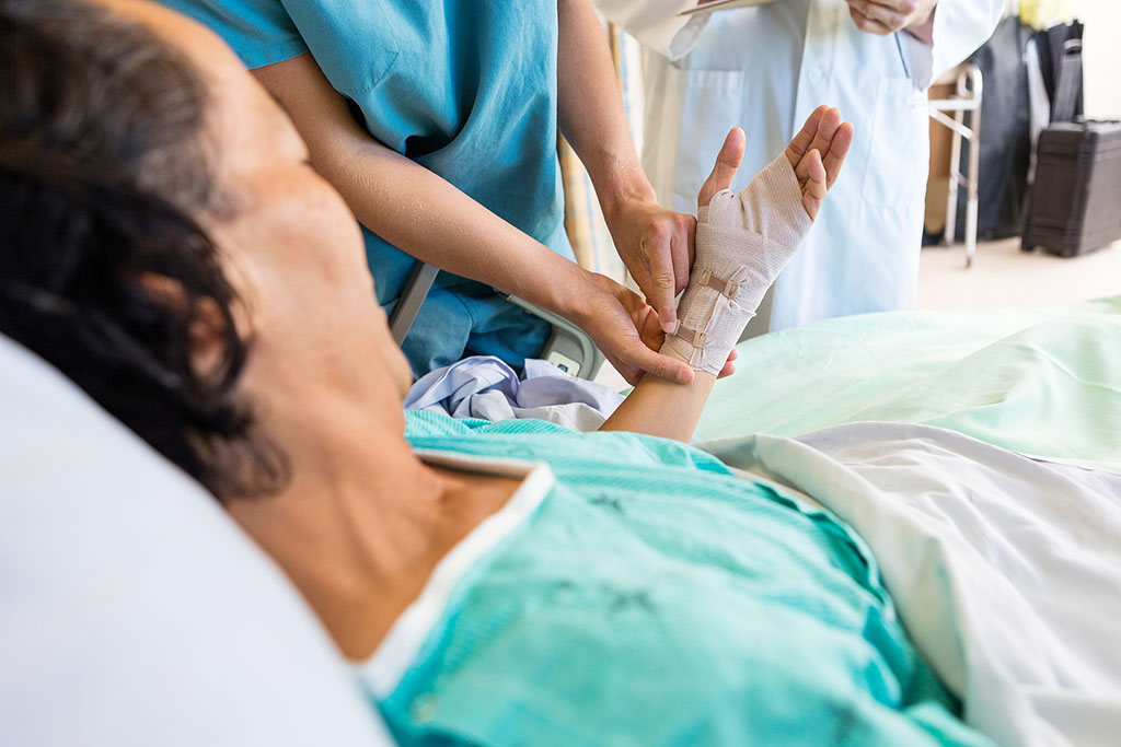 Many seniors face chronic wounds that are difficult to manage. Discover 5 ways a skilled nursing facility addresses non-healing wounds in elderly adults. Closeup Of A Nurse Adjusting The Bandage On A Senior Woman's Hand Non-Healing Wounds In Elderly